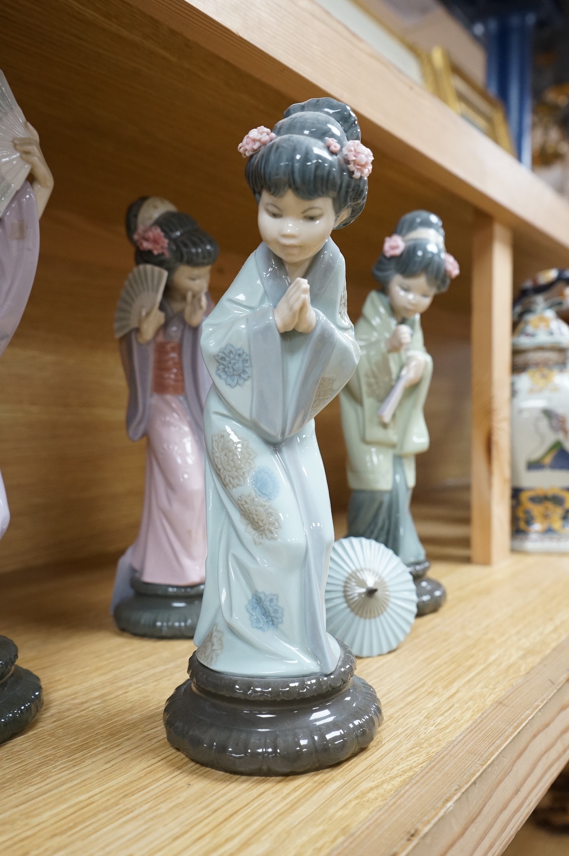 Four Lladro models of Geishas, tallest 30cm
